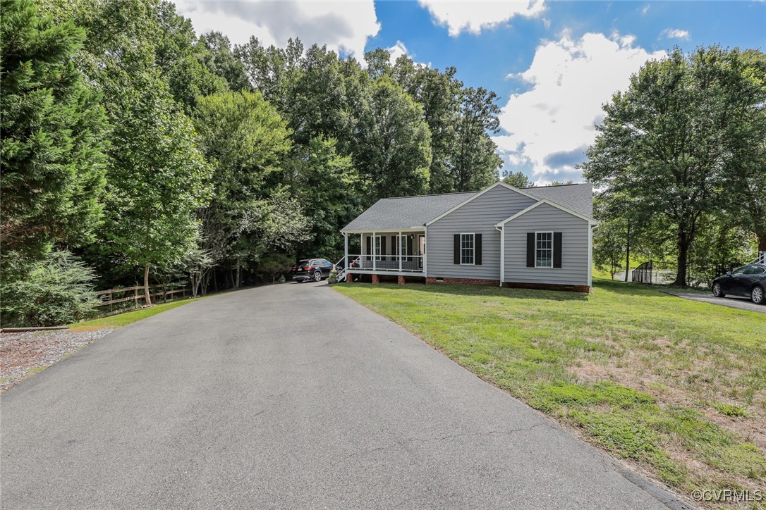 11400 Bailey Mountain Trail Midlothian, VA 23112 - Photo 2 of 41 a front view of a house with garden