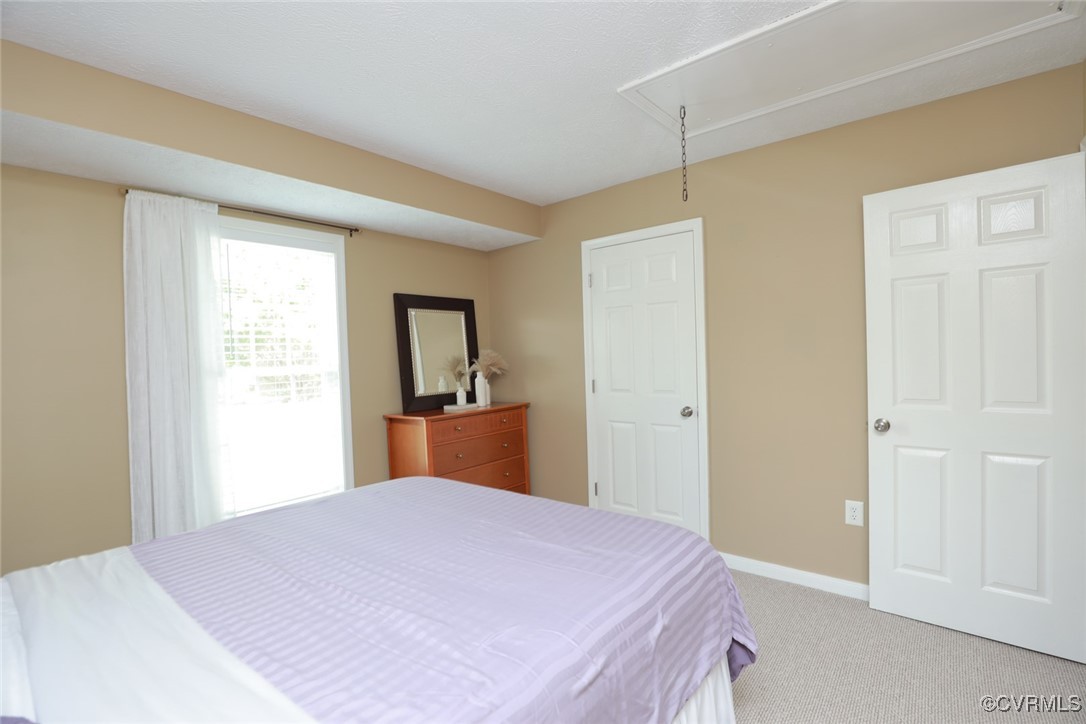 11400 Bailey Mountain Trail Midlothian, VA 23112 - Photo 21 of 41 a bedroom with a bed and a dresser