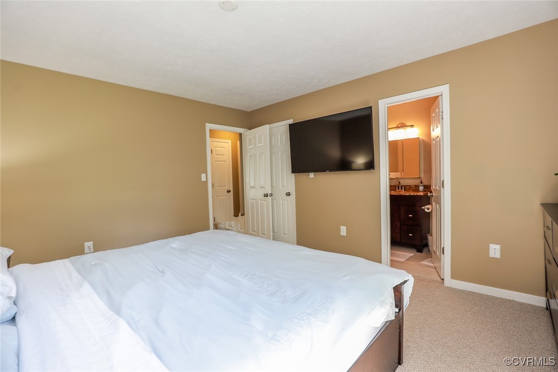 11400 Bailey Mountain Trail Midlothian, VA 23112 - Photo 29 of 41 a bedroom with a bed and a flat screen tv