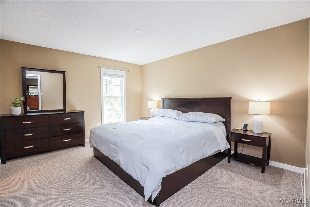 11400 Bailey Mountain Trail Midlothian, VA 23112 - Photo 31 of 41 a bedroom with a bed and a dresser