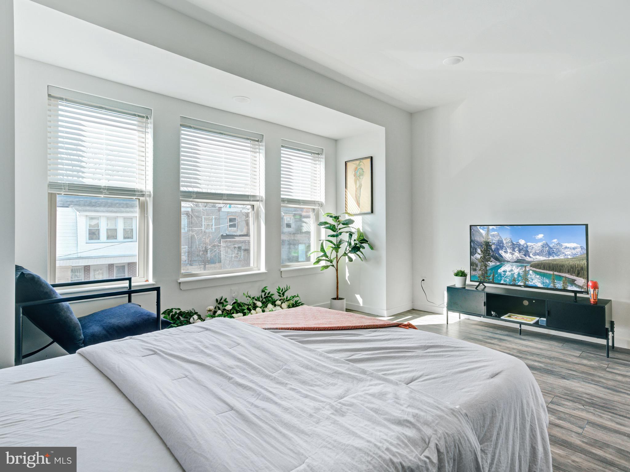 1931 Colonial Street Philadelphia, PA 19138 - Photo 22 of 38 a bedroom with a bed and a flat screen tv