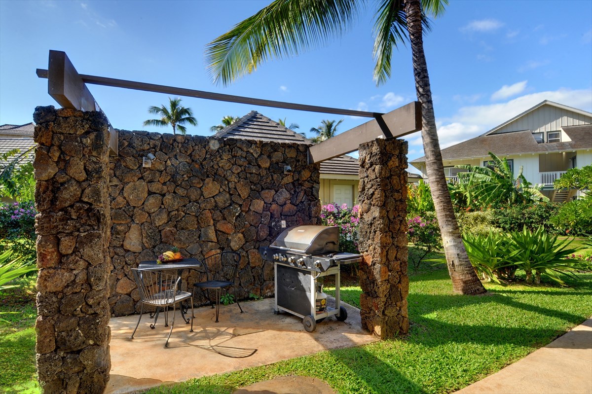 2387 Ho'ohu Road, Unit 221 Koloa, HI 96756 - Photo 11 of 25 a view of a house with backyard and sitting area