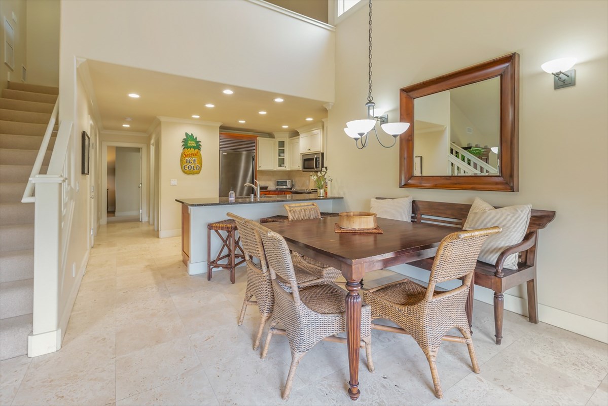 2387 Ho'ohu Road, Unit 221 Koloa, HI 96756 - Photo 12 of 25 a view of a dining room with furniture and a chandelier