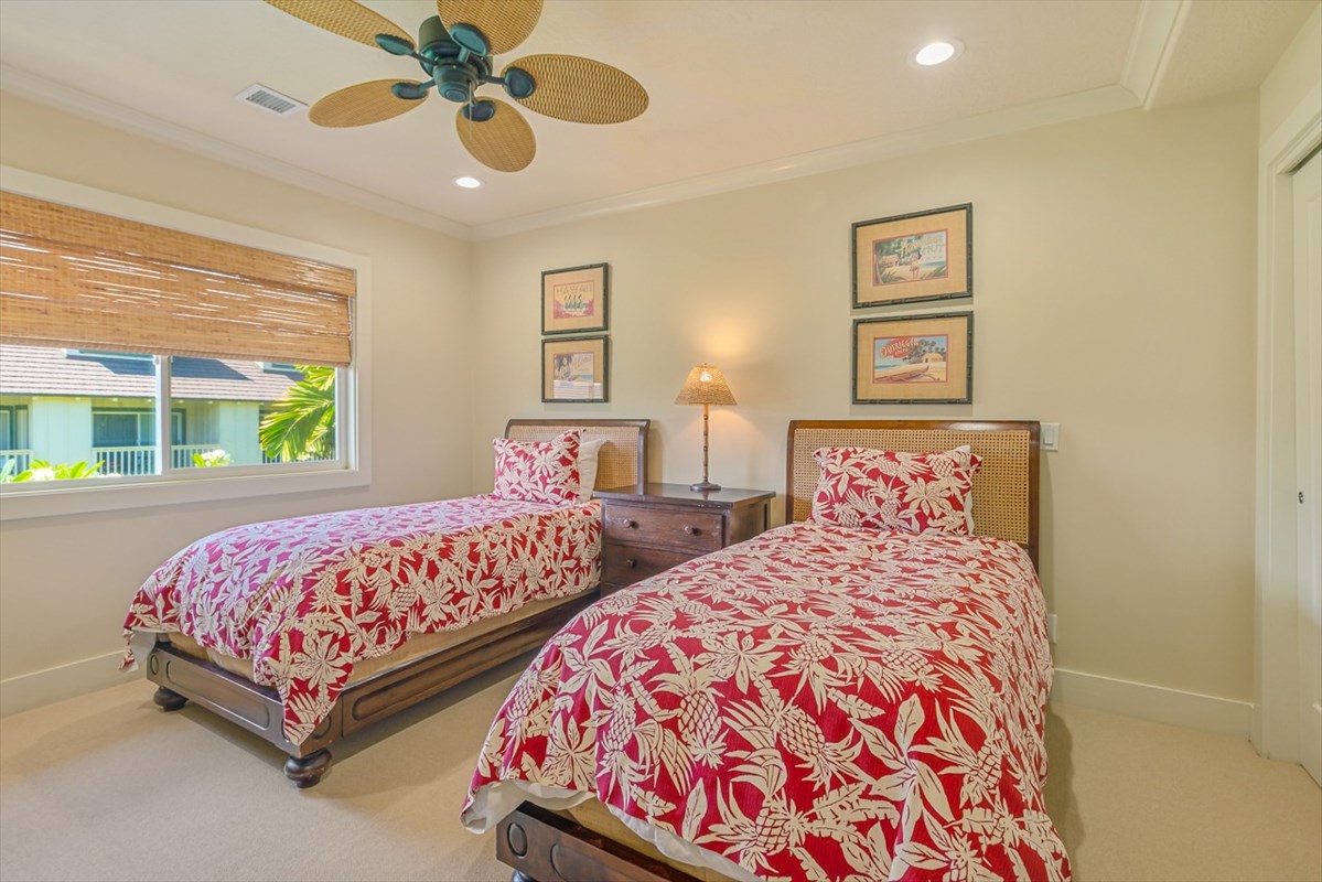 2387 Ho'ohu Road, Unit 221 Koloa, HI 96756 - Photo 17 of 25 a bedroom with two beds and a chandelier