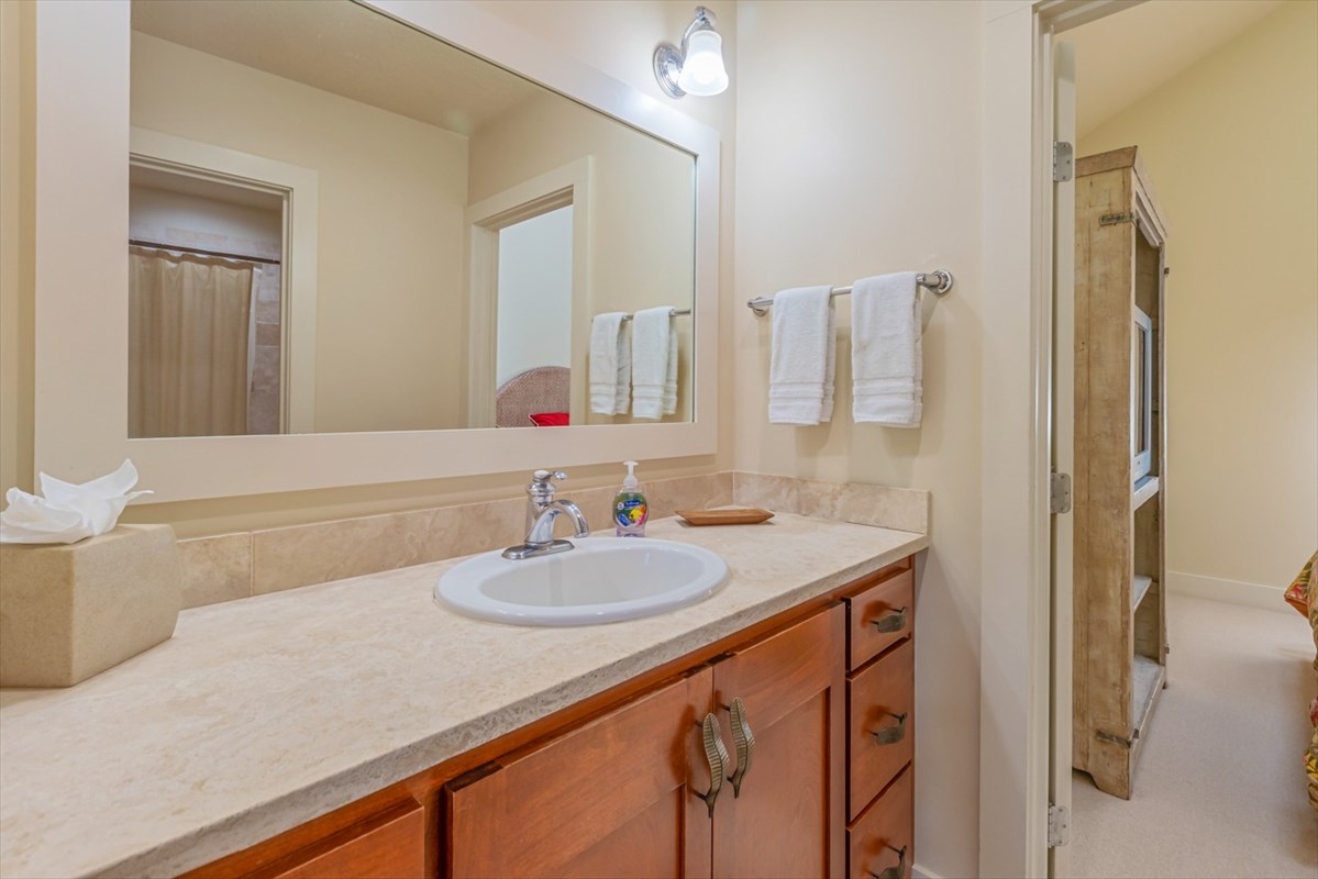 2387 Ho'ohu Road, Unit 221 Koloa, HI 96756 - Photo 20 of 25 a bathroom with a sink and a mirror