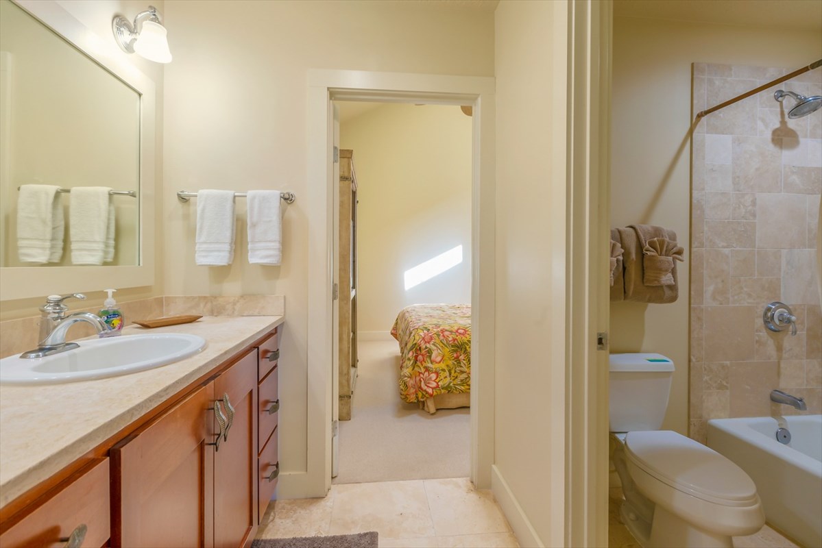 2387 Ho'ohu Road, Unit 221 Koloa, HI 96756 - Photo 22 of 25 a bathroom with a sink a toilet and shower