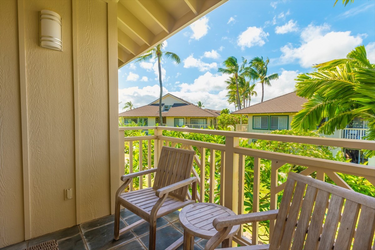 2387 Ho'ohu Road, Unit 221 Koloa, HI 96756 - Photo 25 of 25 a view of an chair and table in the balcony
