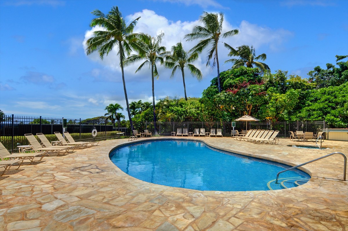2387 Ho'ohu Road, Unit 221 Koloa, HI 96756 - Photo 8 of 25 a swimming pool with outdoor seating and yard