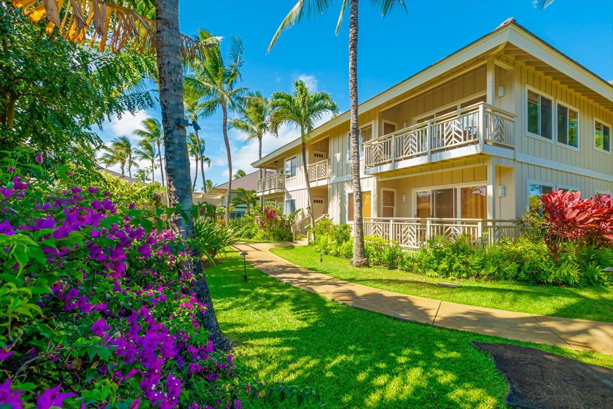 2387 Ho'ohu Road, Unit 221 Koloa, HI 96756 - Photo 10 of 25 a view of a house with a big yard and potted plants