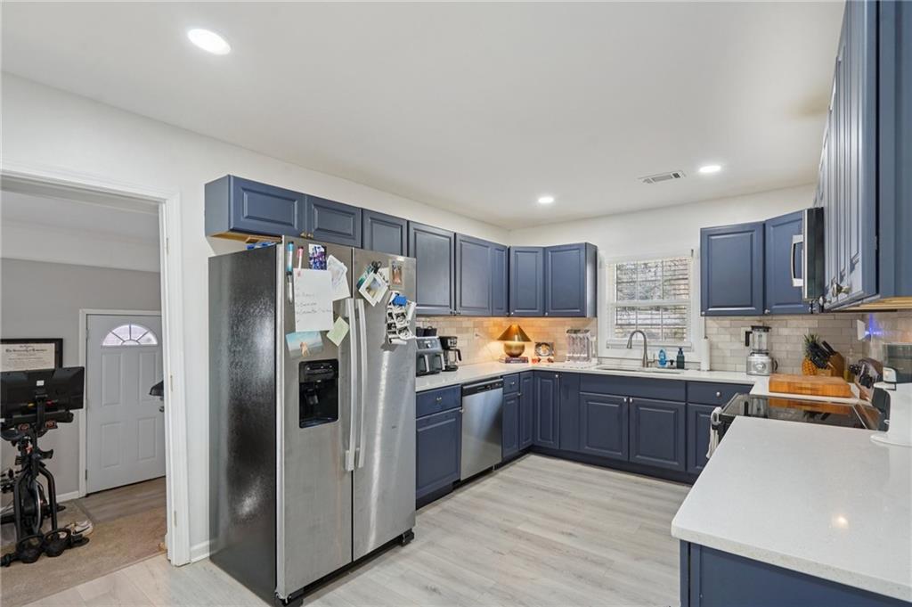 1145 Fayetteville Road Southeast Atlanta, GA 30316 - Photo 11 of 24 a kitchen with stainless steel appliances granite countertop a refrigerator and a sink
