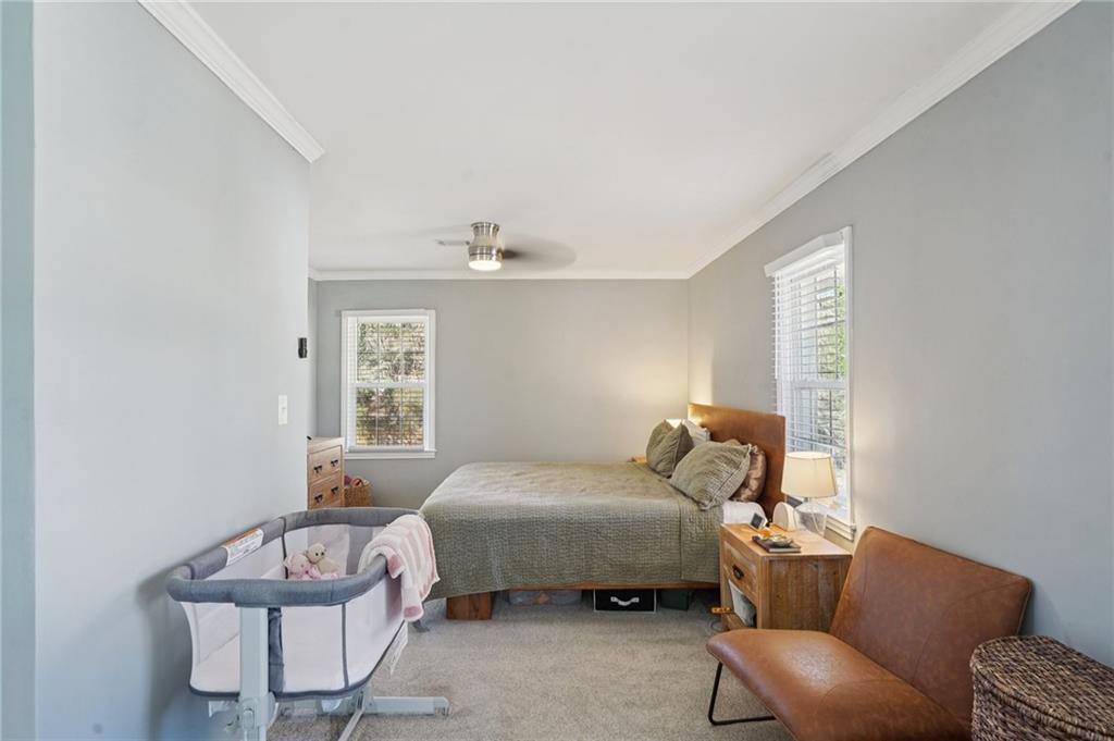 1145 Fayetteville Road Southeast Atlanta, GA 30316 - Photo 18 of 24 a bedroom with furniture and a window