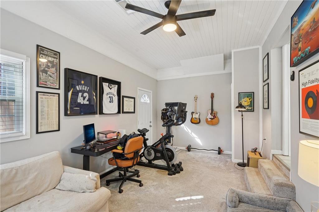 1145 Fayetteville Road Southeast Atlanta, GA 30316 - Photo 21 of 24 a view of a livingroom with workspace and a couch