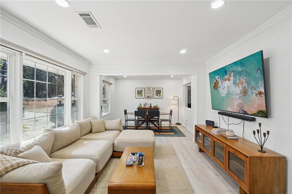 1145 Fayetteville Road Southeast Atlanta, GA 30316 - Photo 3 of 24 a living room with furniture and a flat screen tv