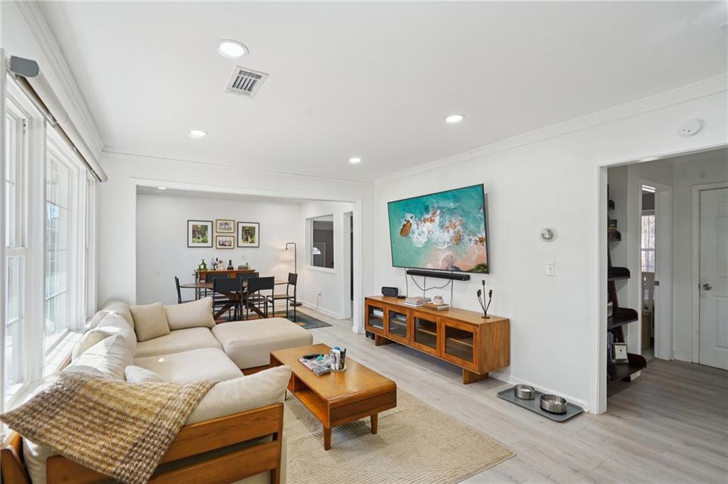 1145 Fayetteville Road Southeast Atlanta, GA 30316 - Photo 4 of 24 a living room with furniture and a flat screen tv