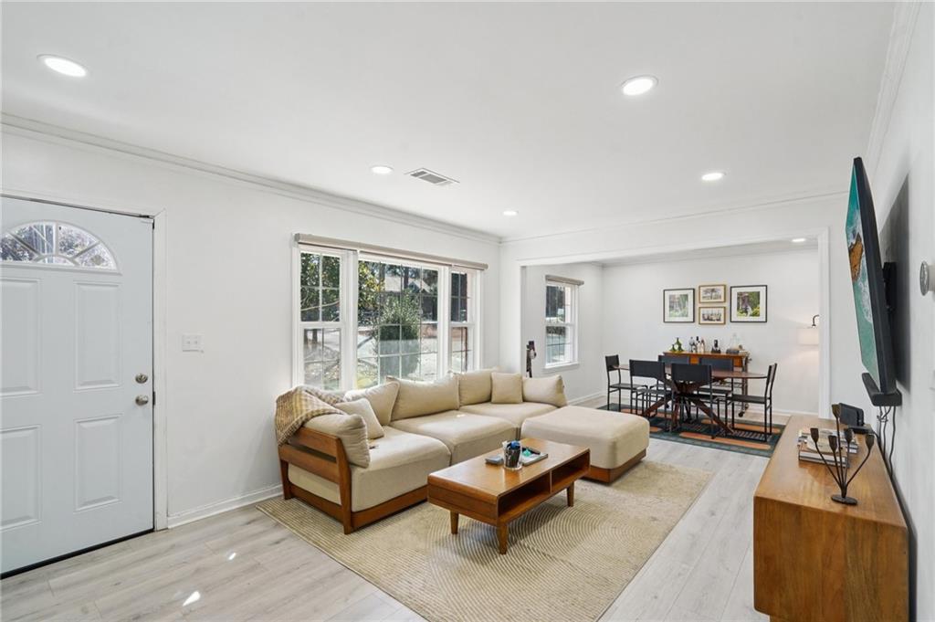 1145 Fayetteville Road Southeast Atlanta, GA 30316 - Photo 5 of 24 a living room with furniture and a flat screen tv