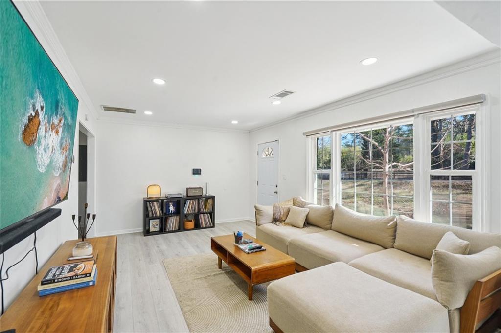 1145 Fayetteville Road Southeast Atlanta, GA 30316 - Photo 6 of 24 a living room with furniture and a flat screen tv