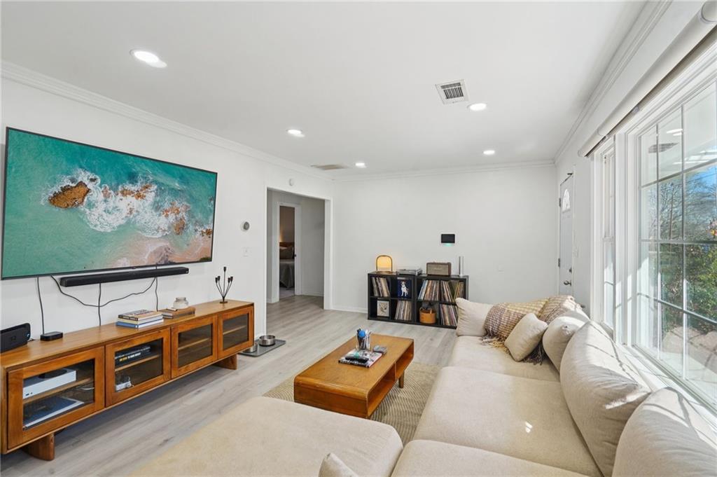 1145 Fayetteville Road Southeast Atlanta, GA 30316 - Photo 7 of 24 a living room with furniture and a flat screen tv
