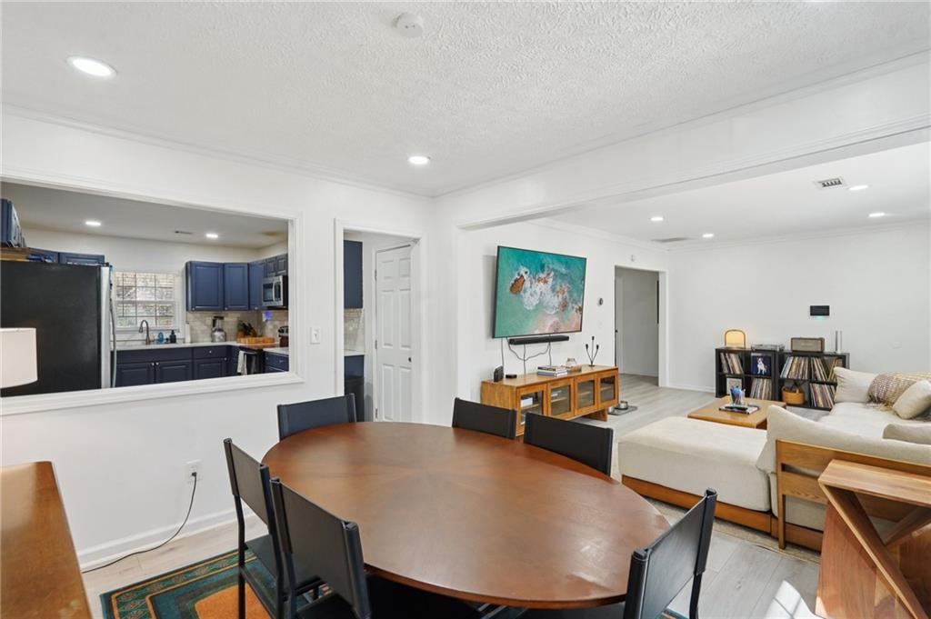 1145 Fayetteville Road Southeast Atlanta, GA 30316 - Photo 10 of 24 a view of a dining room with furniture
