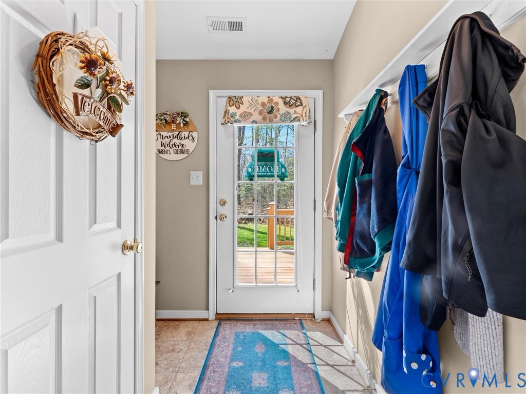 10488 Old Telegraph Road Ashland, VA 23005 - Photo 23 of 69 a view of walk in closet with clothes and shoes