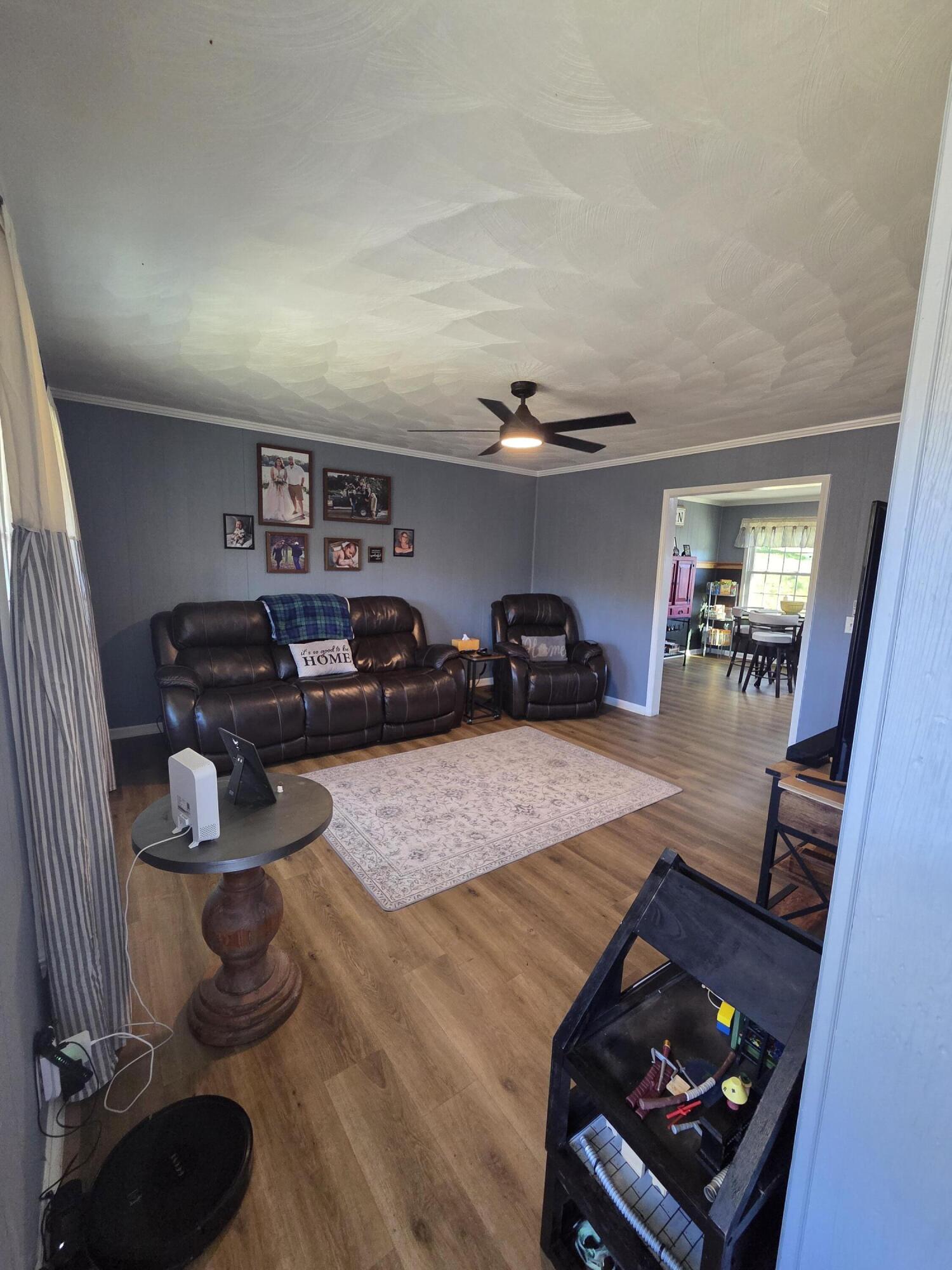 3266 Doe Run Road Rocky Mount, VA 24151 - Photo 4 of 8 a living room with furniture and a dining table