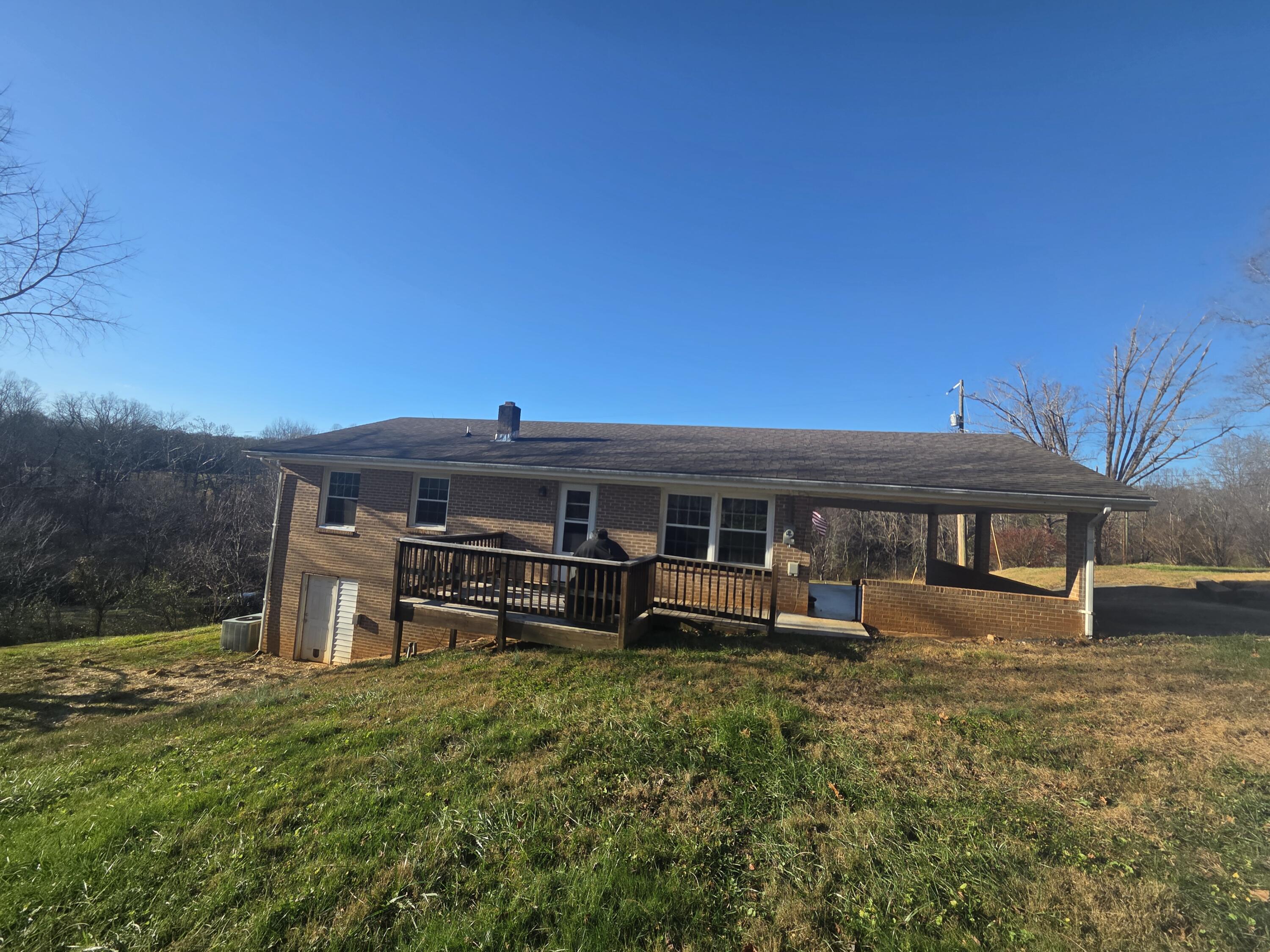 3266 Doe Run Road Rocky Mount, VA 24151 - Photo 7 of 8 a front view of a house with a yard