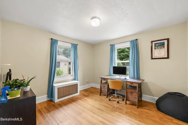 a workspace with furniture and wooden floor