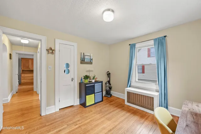a bedroom with a bed and a view of bathroom