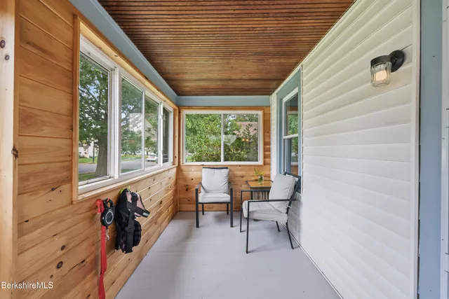 a view of a two chairs in the balcony