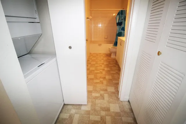 a bathroom with a shower and a door