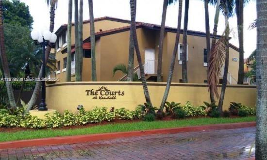 15640 Southwest 80th Street, Unit G103 Miami, FL 33193 - Photo 1 of 11 a sign on the side of a building