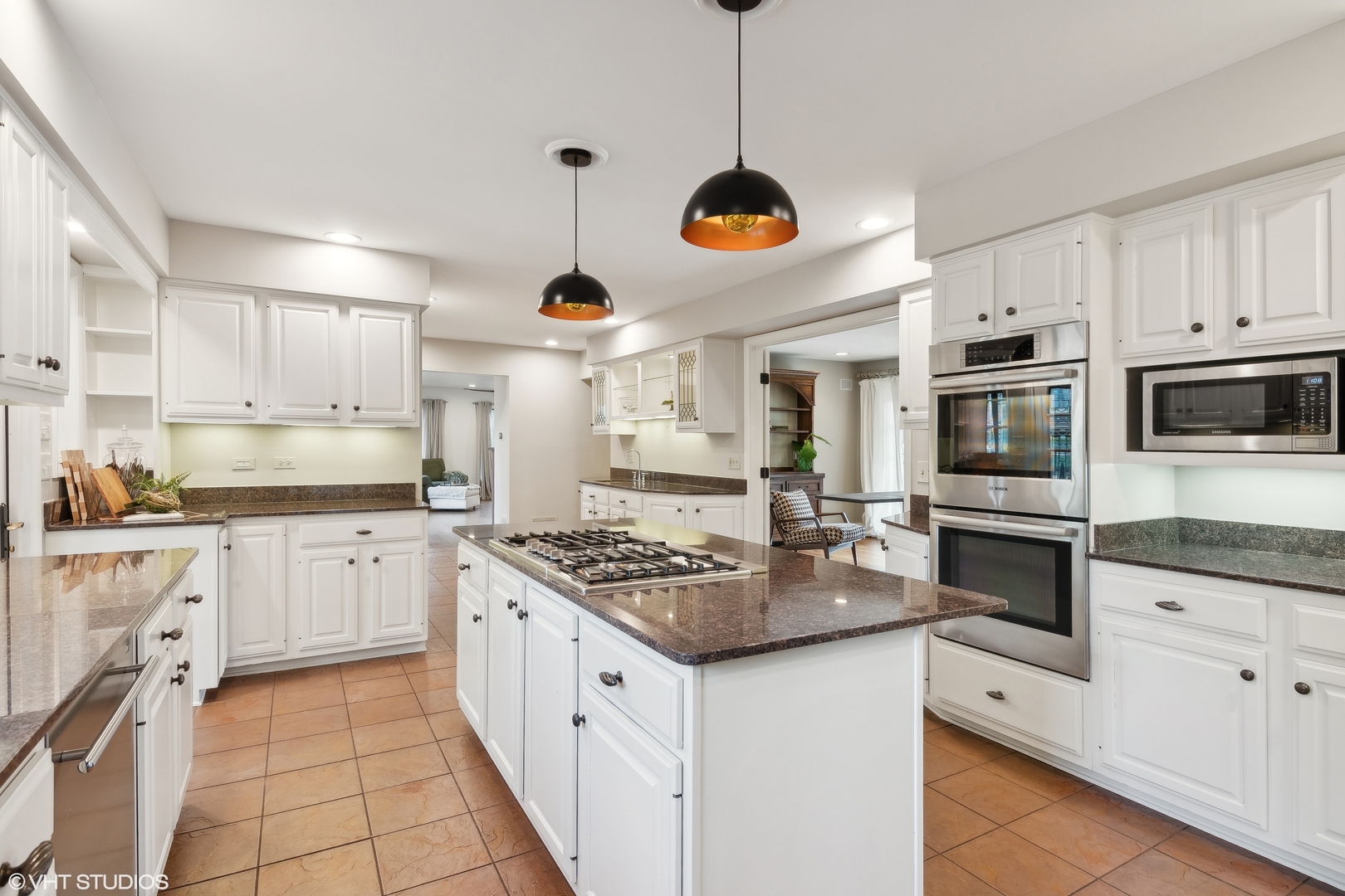 1364 Turvey Road Downers Grove, IL 60515 - Photo 14 of 35 a kitchen with stainless steel appliances granite countertop a stove a sink and a microwave