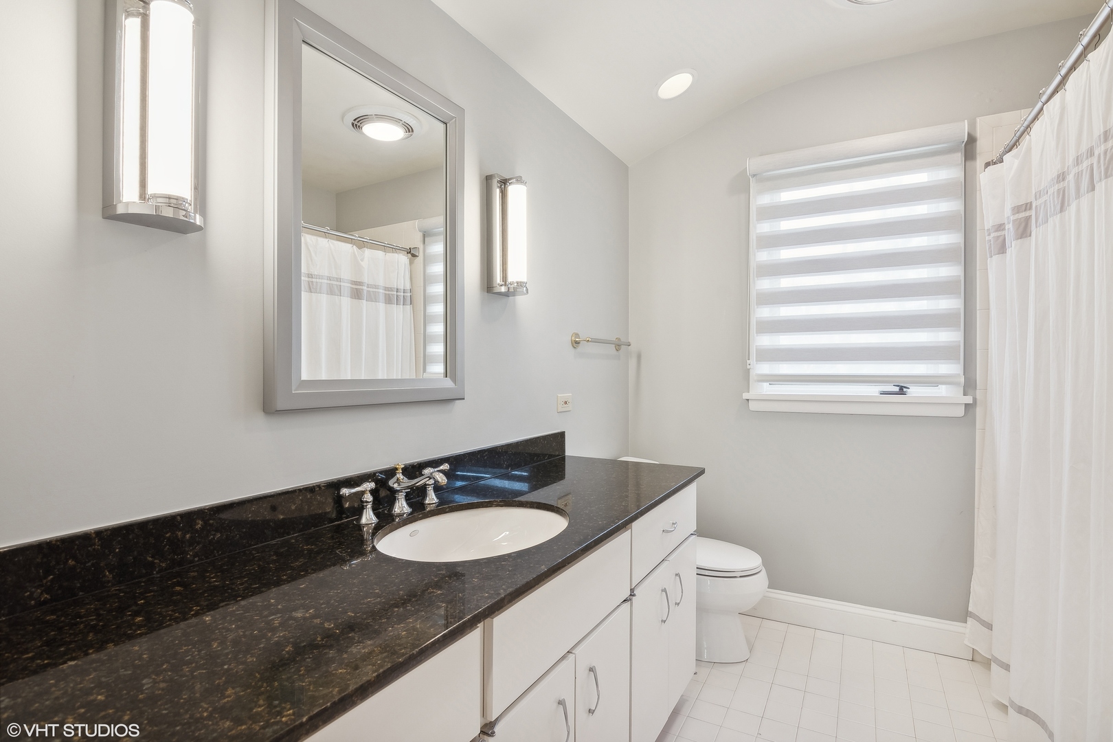 1364 Turvey Road Downers Grove, IL 60515 - Photo 25 of 35 a bathroom with a granite countertop sink toilet a mirror and a window