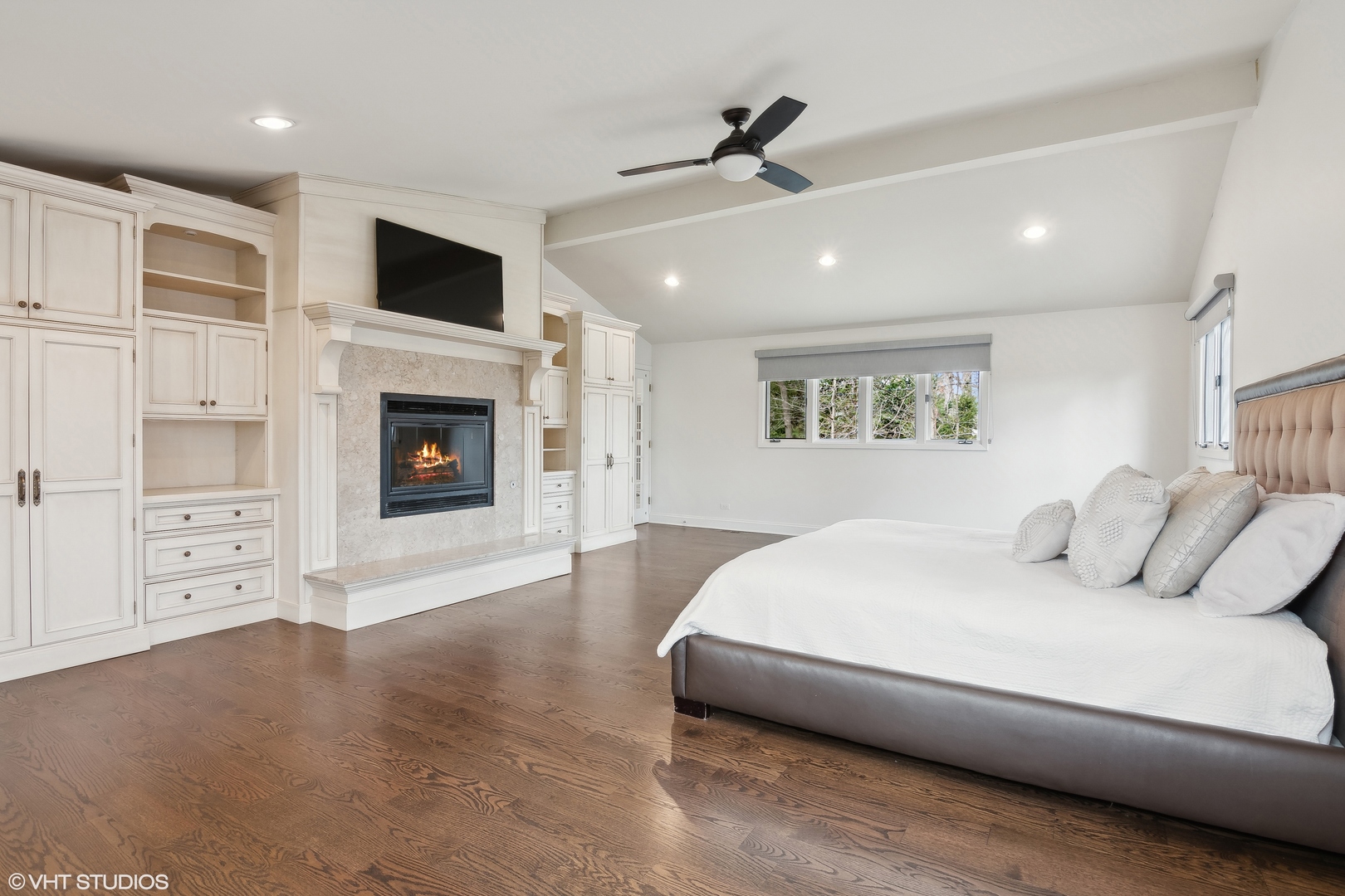1364 Turvey Road Downers Grove, IL 60515 - Photo 31 of 35 a spacious bedroom with a large bed and a fireplace