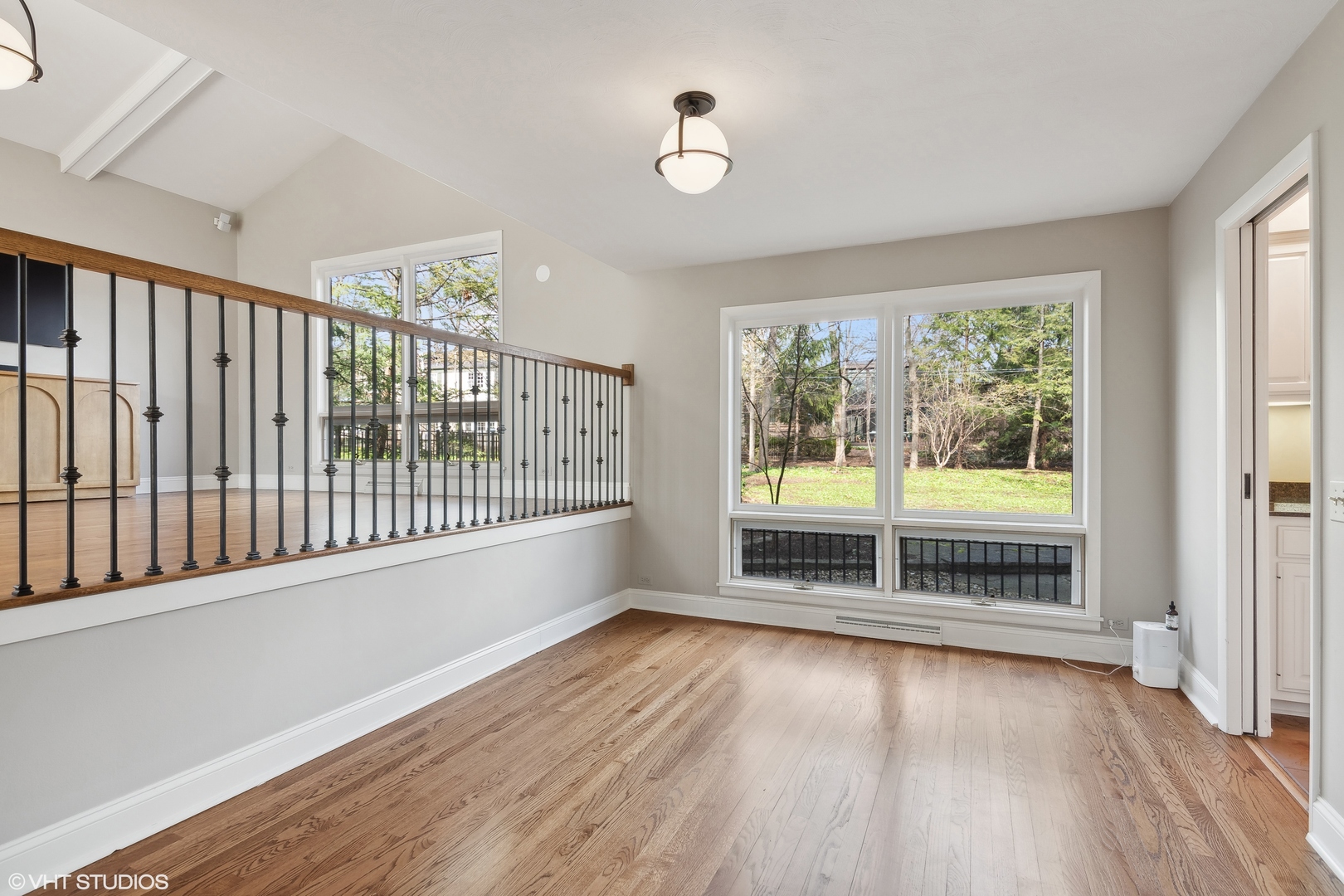 1364 Turvey Road Downers Grove, IL 60515 - Photo 9 of 35 a view of an empty room with wooden floor and a window