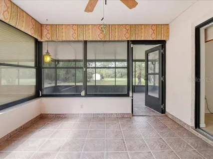 a bathroom with a tub and window
