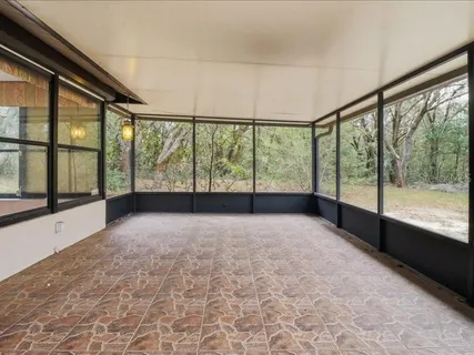 a view of an empty room with a large window