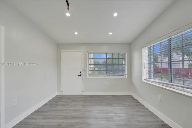 a view of an empty room with a window
