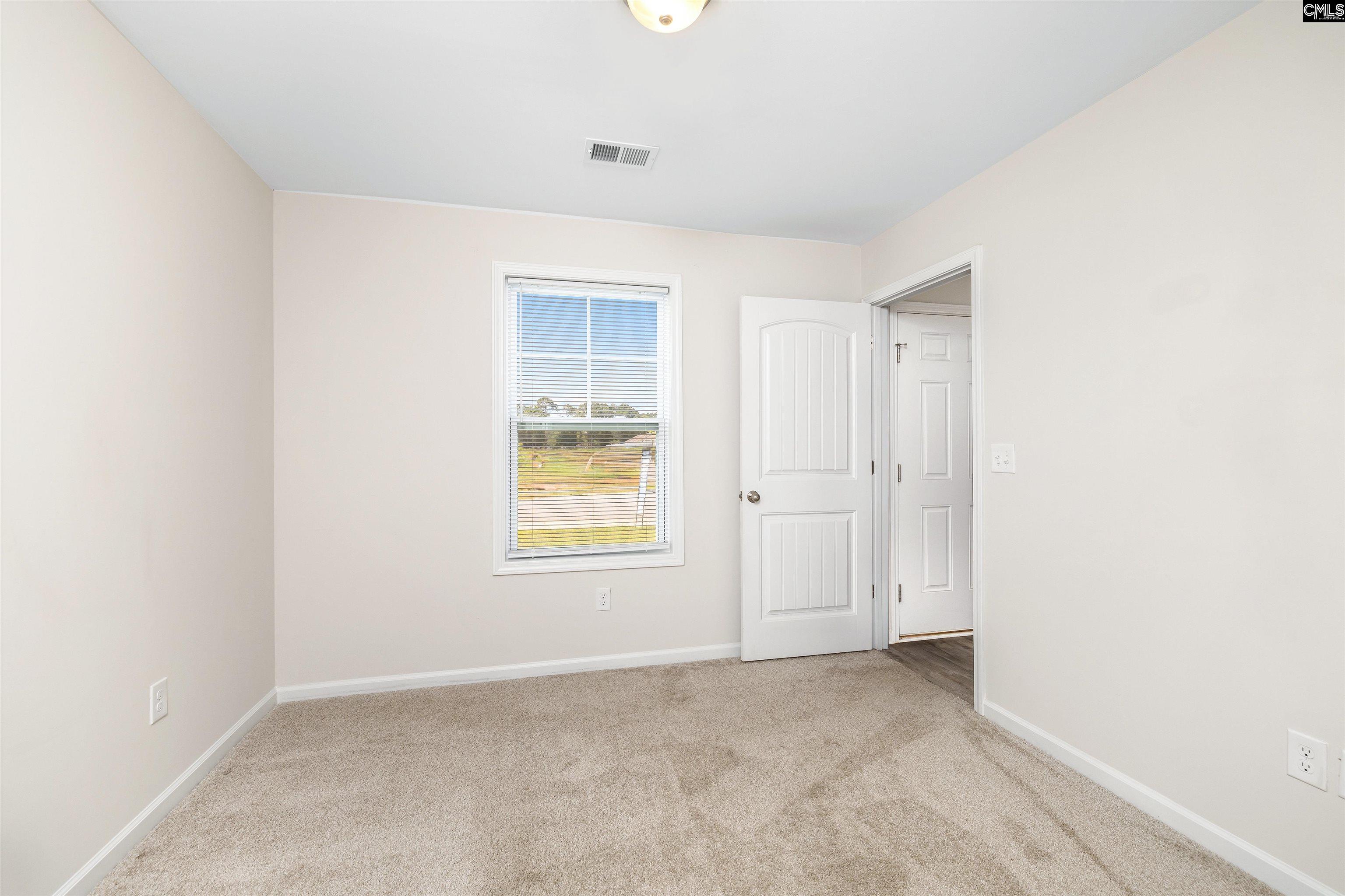 2157 Still Pointe Drive Sumter, SC 29154 - Photo 8 of 25 an empty room with windows and closet