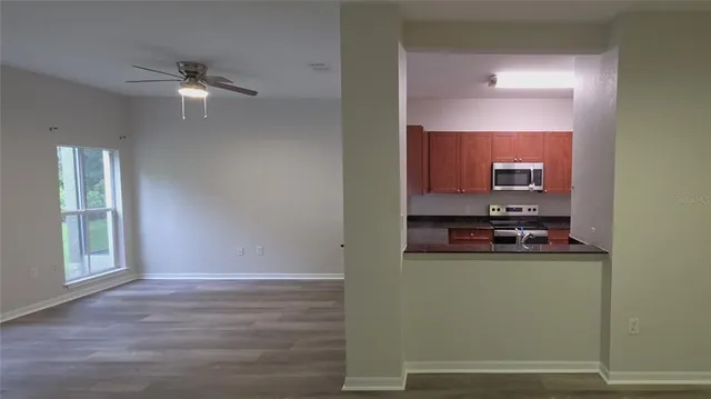 a hallway with a sink and a mirror