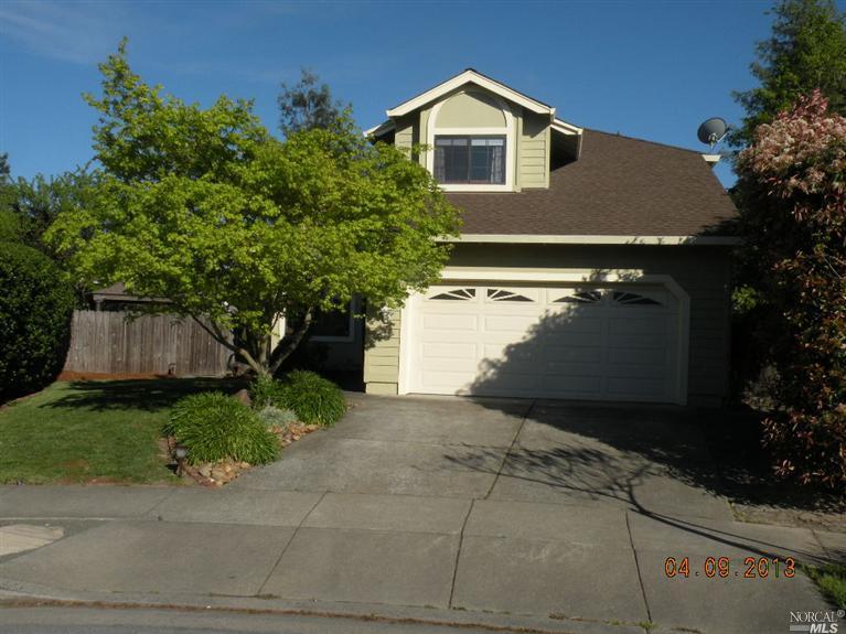 2402 Button Court Santa Rosa, CA 95403 - Photo 1 of 1 a front view of a house with a yard