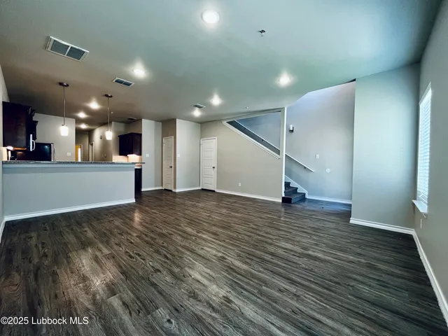 a view of a kitchen with a sink and a stove top oven
