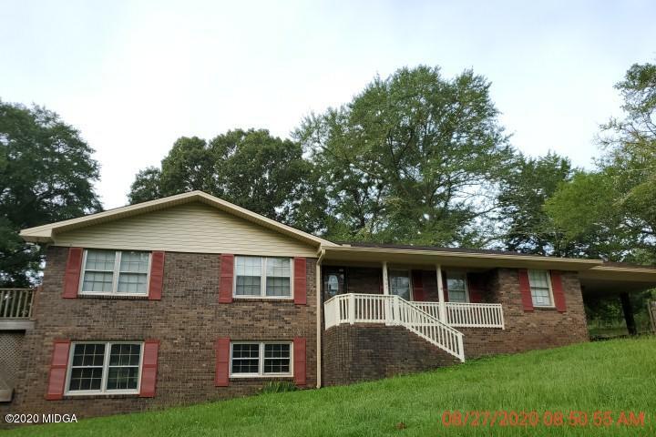 2465 Pate Road Macon, GA 31210 - Photo 1 of 28 a front view of a house with garden