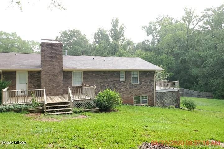 2465 Pate Road Macon, GA 31210 - Photo 16 of 28 a backyard of a house with table and chairs