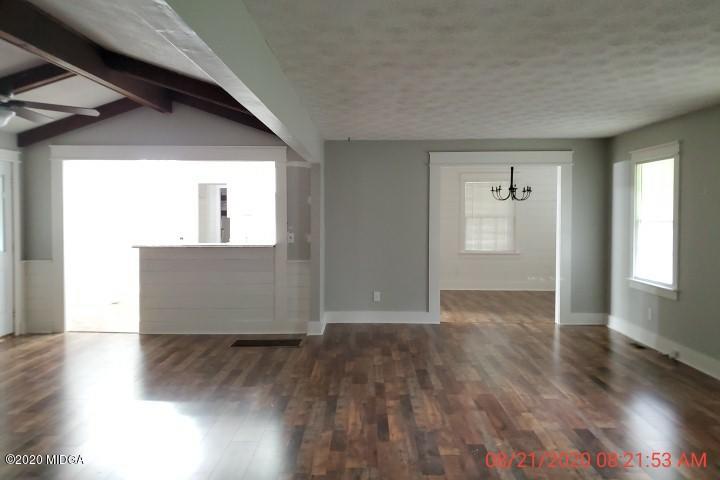 2465 Pate Road Macon, GA 31210 - Photo 17 of 28 an empty room with wooden floor and windows