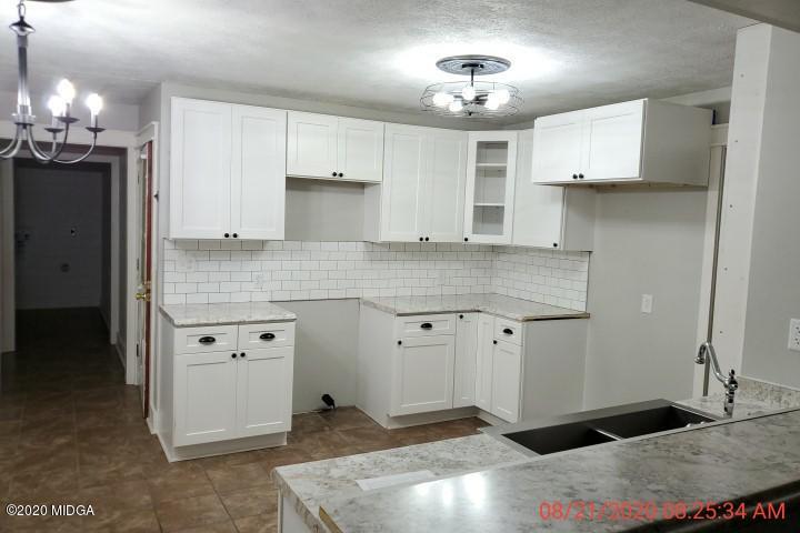 2465 Pate Road Macon, GA 31210 - Photo 22 of 28 a kitchen with cabinets appliances and a counter space