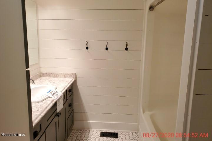 2465 Pate Road Macon, GA 31210 - Photo 8 of 28 a bathroom with a granite countertop shower and a sink