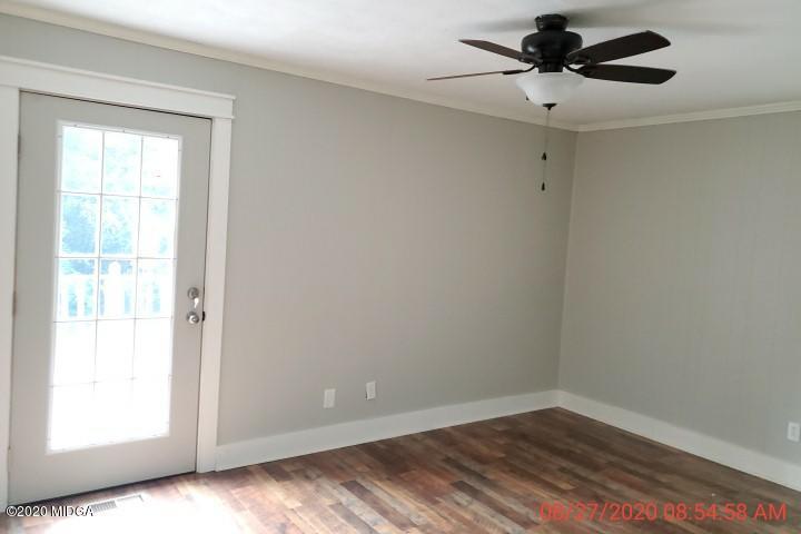 2465 Pate Road Macon, GA 31210 - Photo 9 of 28 wooden floor in an empty room with a window