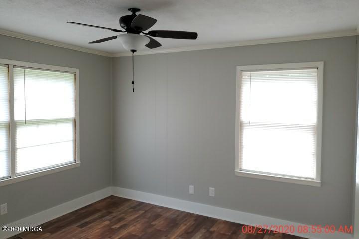 2465 Pate Road Macon, GA 31210 - Photo 10 of 28 a view of an empty room with wooden floor and a window