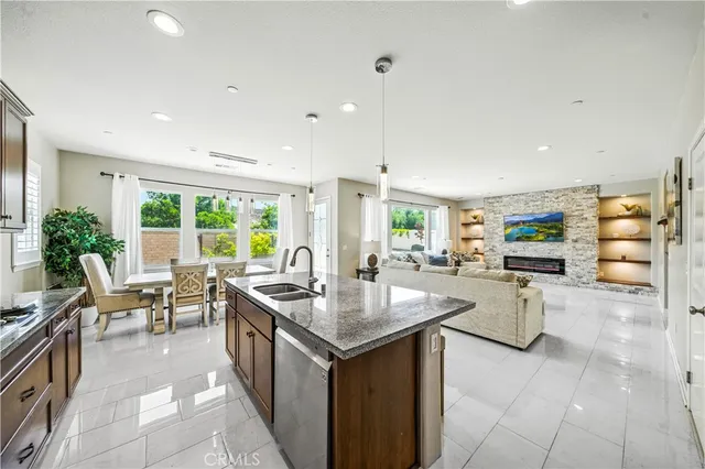 a kitchen with sink stove and cabinets
