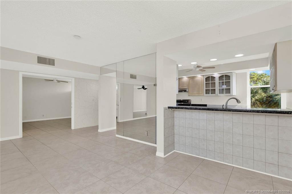 1950 Southwest Palm City Road, Unit 13301 Stuart, FL 34994 - Photo 17 of 58 a view of kitchen with stainless steel appliances granite countertop a refrigerator and a sink